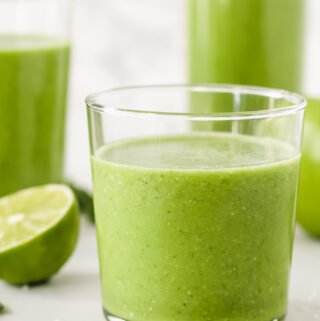 mojito smoothies in glasses with lime wedges