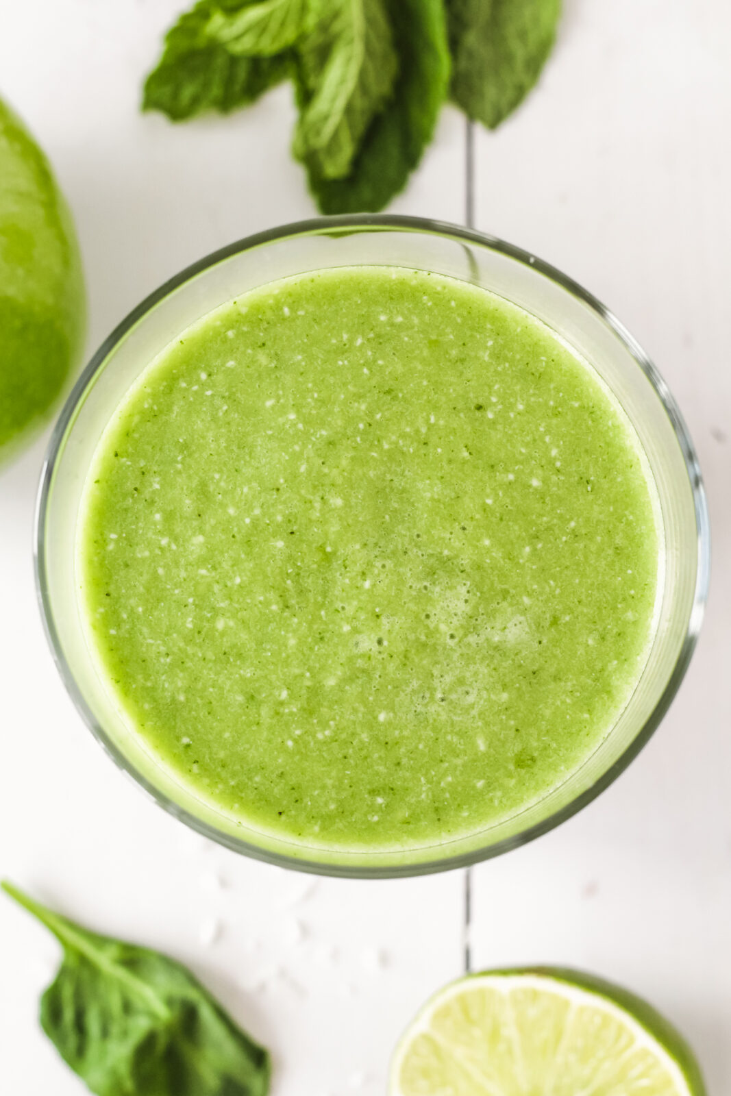overhead photo closeup of green mojito smoothie