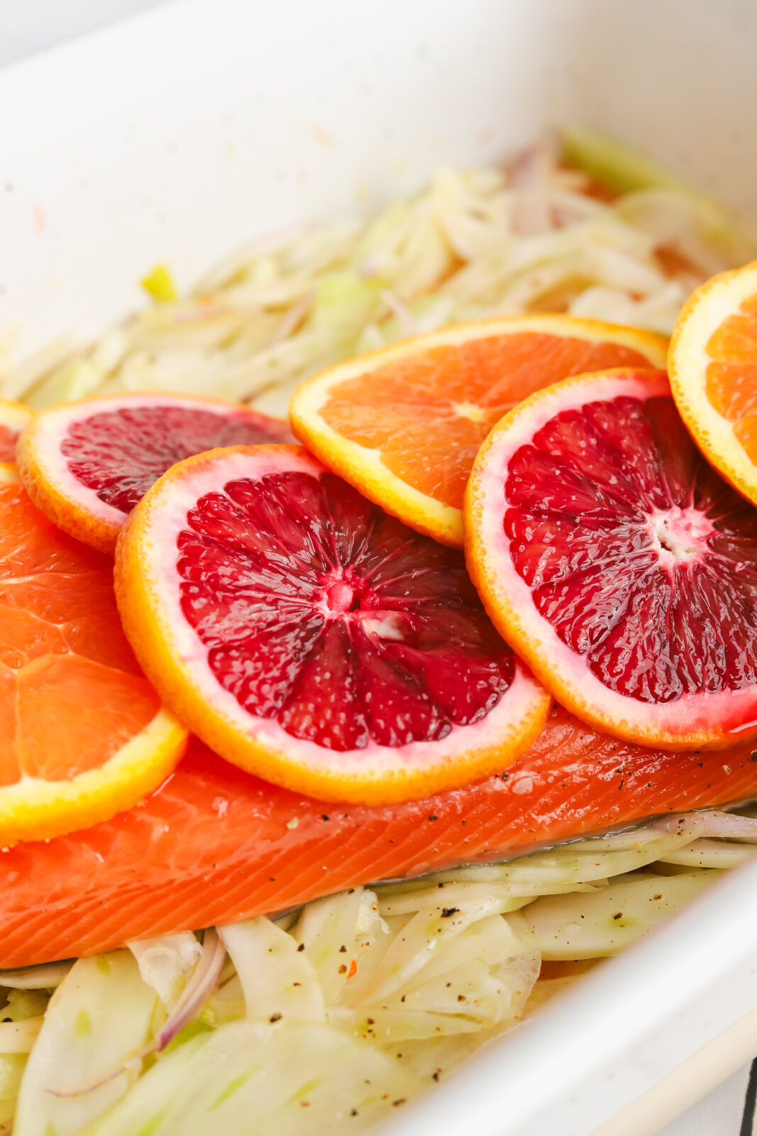 close up of citrus slices on a piece of salmon