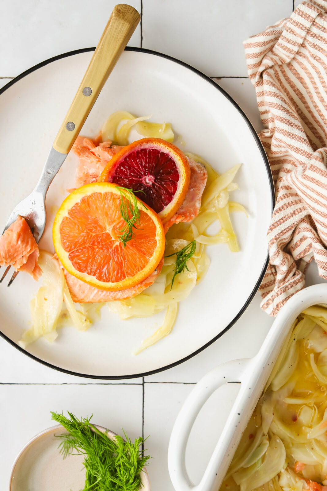 piece of slow roasted salmon with fennel on a plate