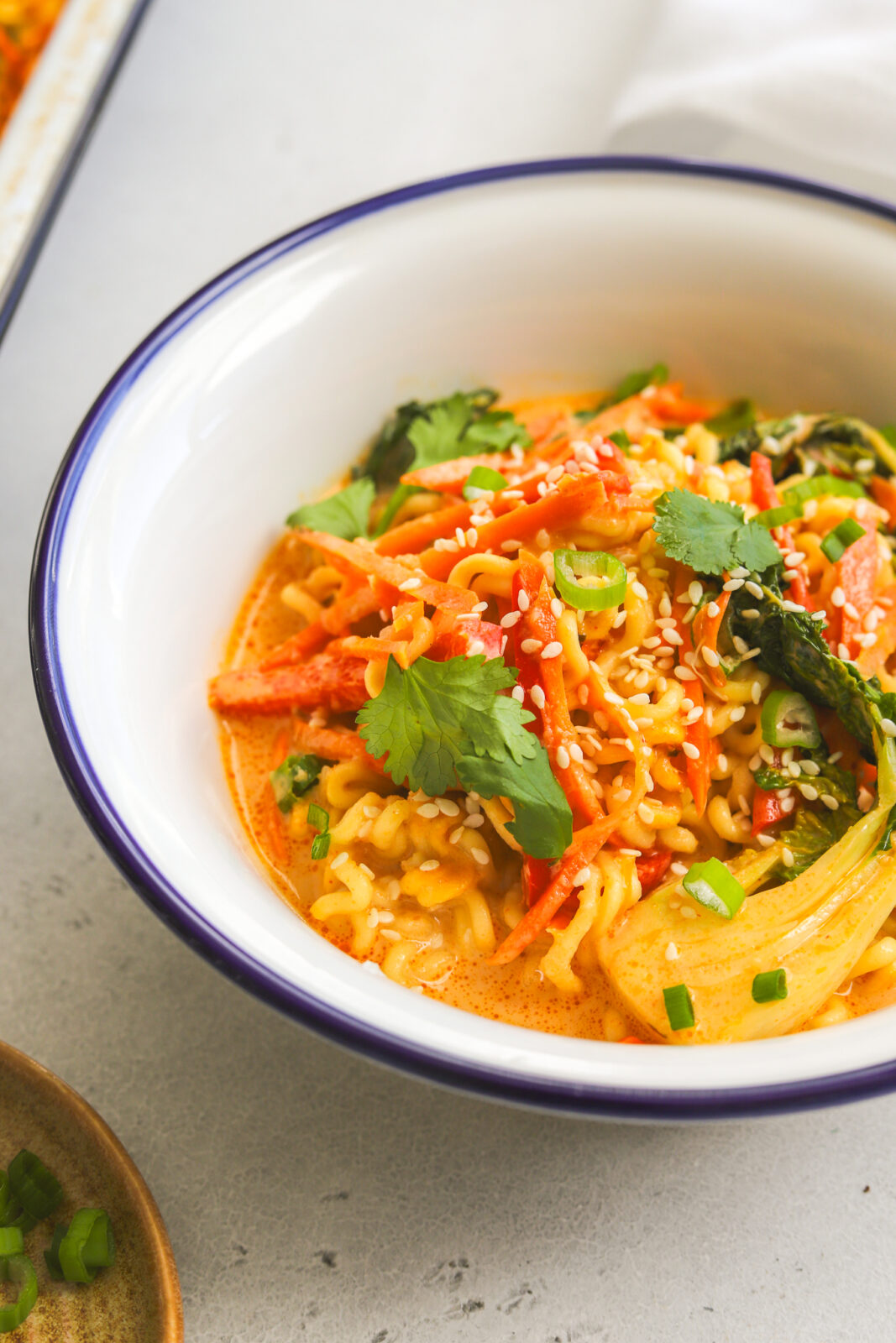 side angle of ramen noodles and vegetables in a bowl