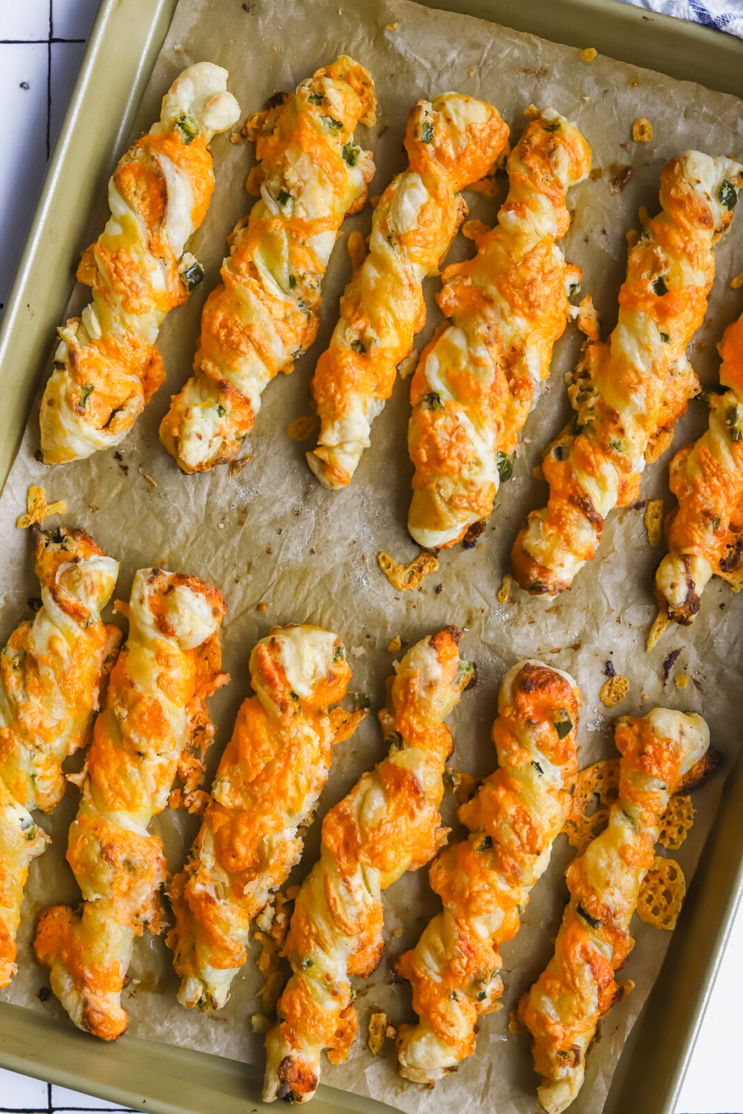 jalapeno popper cheese twists on a baking sheet