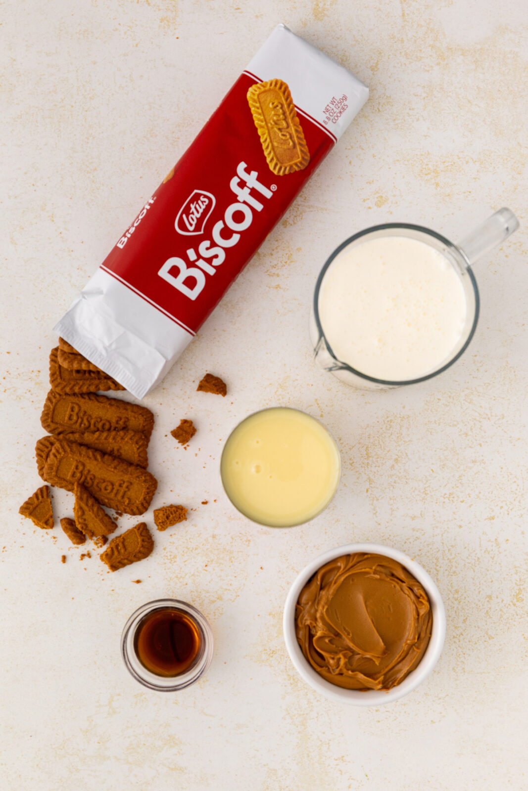 biscoff cookies, heavy cream, biscoff spread, condensed milk in bowls