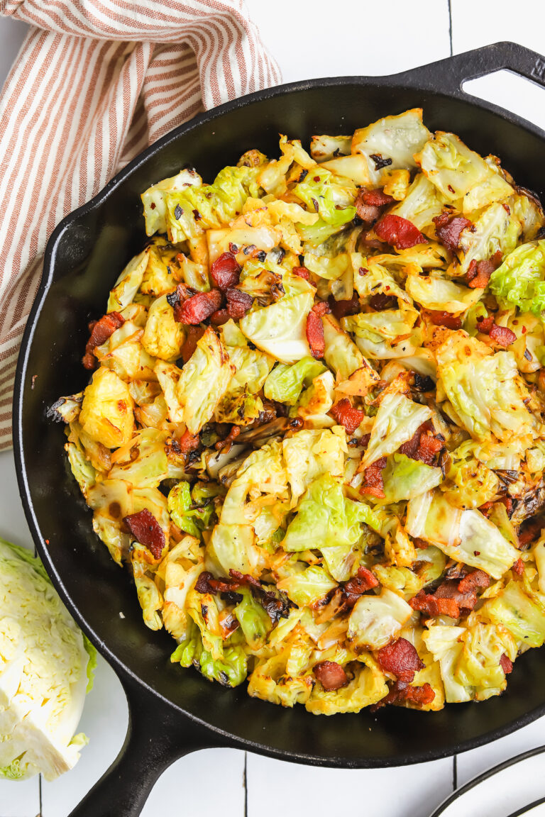 savoy cabbage and bacon sauteed in a cast iron pan