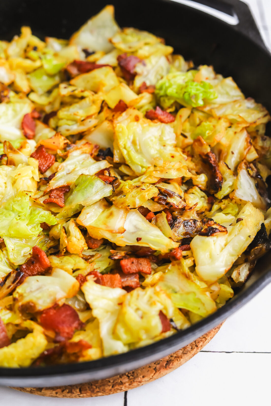 side angle of cooked cabbage in a pan